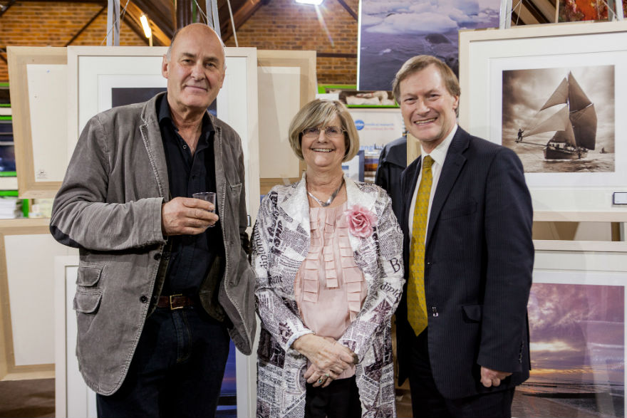 Renowned photographer Charlie Waite with Lynn and her local MP at one of the many art exhibitions she curated and organised.