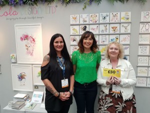 Lesley Dunne (right) and Lisa Dean (left) from Feathering Your Nest with Amanda Mountain on Lola Design's stand