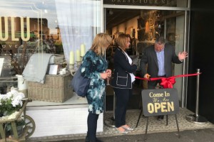 Tony Roberts opens Louise Helyer's (standing to his right) new store.