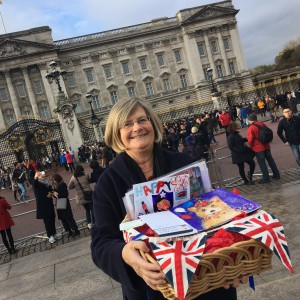 Lynn Tait delivering the Queen her 90th birthday cards that had been designed as a result of a great competition Lynn instigated involving loads of schoolchildren.