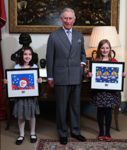 HRH Prince Charles with the winners of the 2013 design a Christmas stamp competition. This year’s designs will go on sale at the start of November.