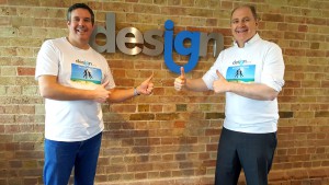 Above: IG Design Group’s ceo Paul Fineman (right) and Anthony Lawrinson, chief financial officer, wearing their ‘debt free’ t-shirts after the group announced its impressive results.