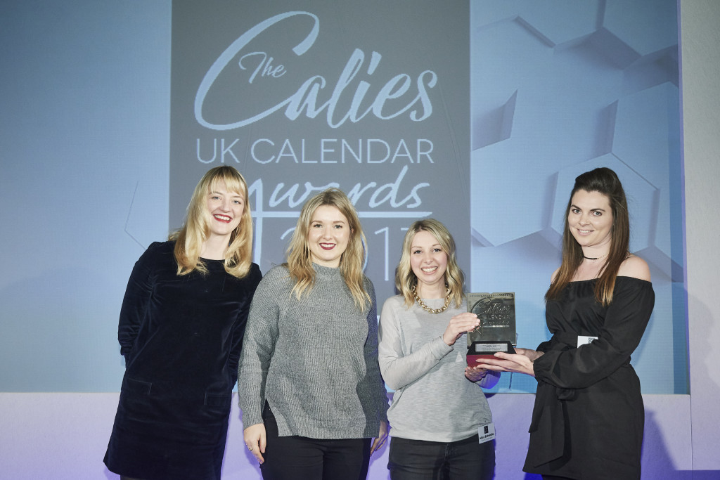 Calendar Club’s buying manager, Becky Salter presented the trophy to Portico Designs’ sales and marketing director Charlie Bassil (2nd left) and project manager Alice Entwistle.