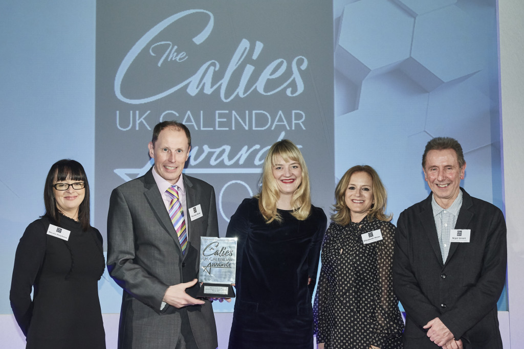 (Second left-right) Rose Calendars’ pre-press manager Nicola Stephens, managing director Michael Rose and marketing manager Elizabeth Rose, were presented with the award by Nigel Green, owner of 8 Days a Week.