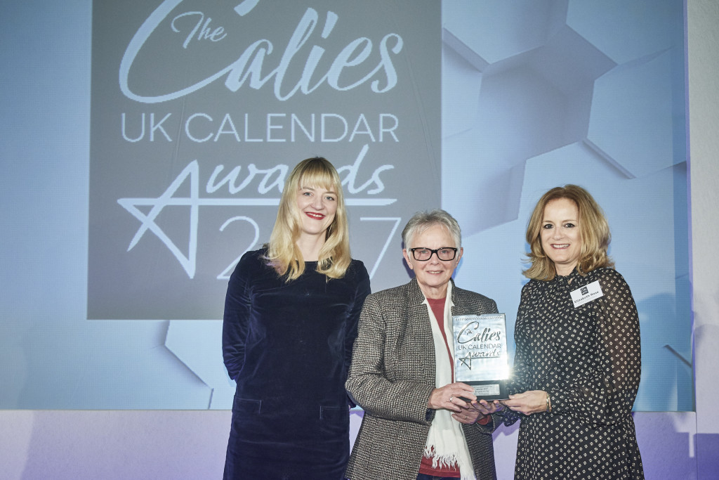 Pomegranate’s sales director, Ley Bricknell (centre) was presented with the award by Elizabeth Rose, marketing manager of Rose Calendars.