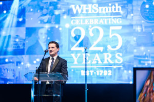 WHSmith’s ceo Stephen Clarke on stage at the anniversary charity ball.