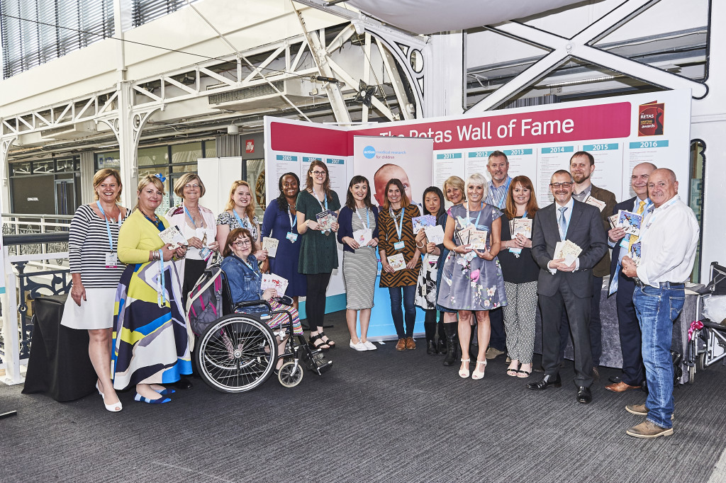 Lynn Tait (3rd from left) at PG Live 2016 with the artists who donated designs and those involved in the cards’ production that year.