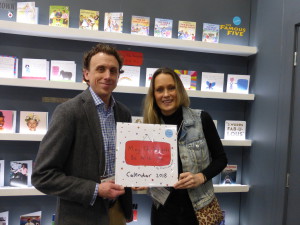 Charlotte Reed on the Danilo stand at the Spring Fair with the publisher’s licensing director Dan Grant holding the wall calendar that is being published for 2019.