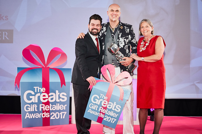 David Hicks (pictured centre) won the Honorary Achievement Award at The Greats gift awards last year. (He is pictured with Charlie Baker, who hosted the event and the GA’s Henri Davies, sponsor of the award).