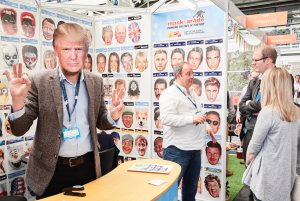 Ray Duffy (far right) on Mask-arade’s stand at last year’s PG Live, with ‘the Donald’.