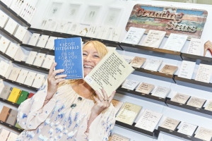 Beth Genower, co-founder and creative director of Five Dollar Shake and Counting Stars at PG Live last week with a copy of a F. Scott Fitzgerald book and one of the Counting Stars notebooks that feature his and his wife Zelda’s words.