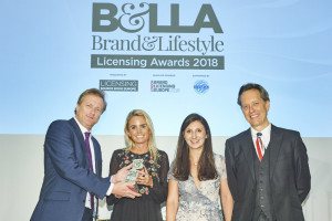 John Lewis’ assistant buyer of greeting cards, wrap and seasonal events, Lizzie Batchelar (second left) together with colleague Rosie Bick collected the awards for Best Department Store Retailer of Licensed Brands at the B&LLA Awards a few months ago. They collected the award from Giles Andreae of co-founder of Happy Jackson (left) and host Richard E Grant.
