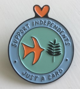 Show your support of the Just a Card campaign with a pin for £10.