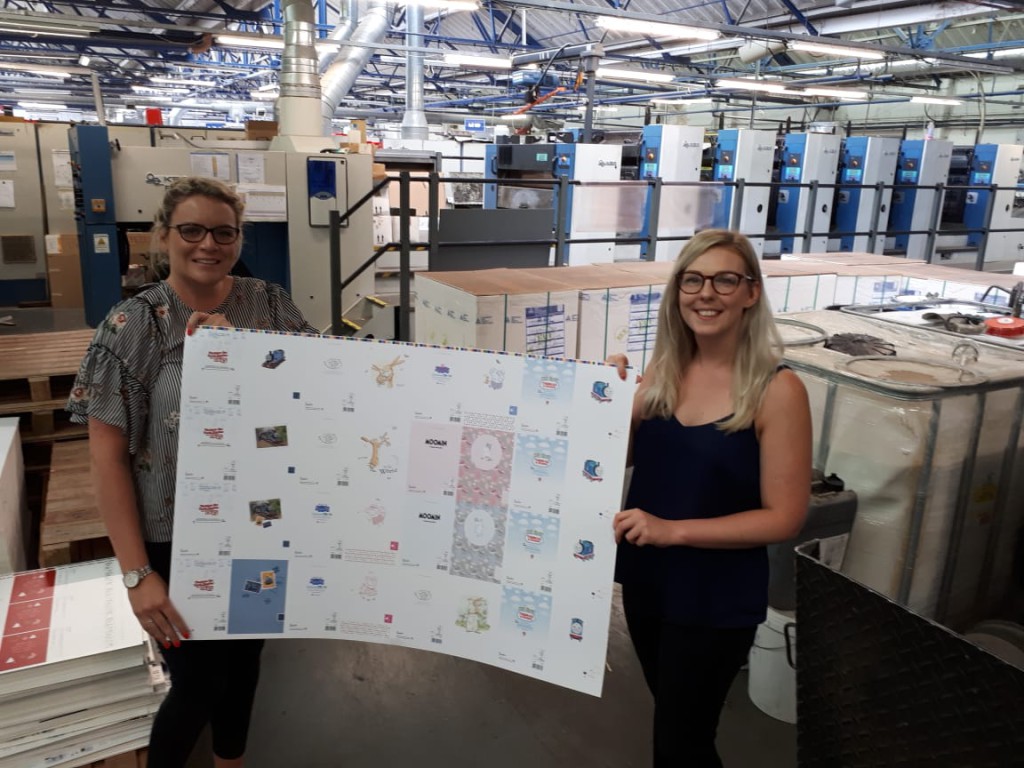 Senior product manager, Becky Anderson and assistant product manager, Holly Parkin watching the cards come off the press.
