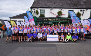 The 65 Light Fund cyclists at the end of their 325-mile route last Friday.