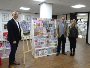 Above: IG Design Group UK’s (left-right) David Jackson, channel controller of everyday cards; Adrian Coates, commercial director and Laura Norgrove, design manager of everyday cards in front of a mock up Aldi fixture. 