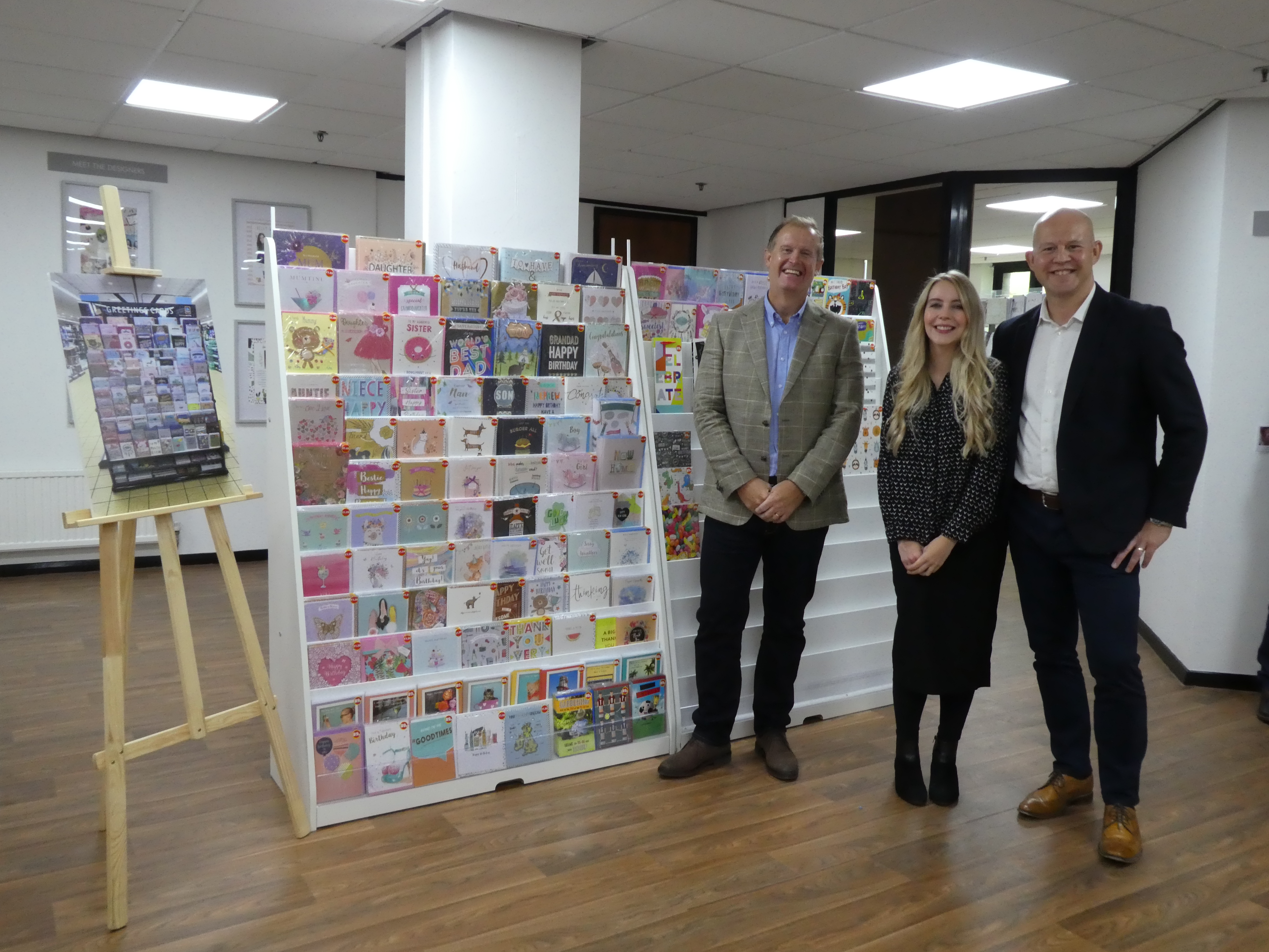 Above: (Right-left) IG Design Group’s Adrian Coates, Laura Norgrove and David Jackson with a mock-up of the Aldi designs in the company’s UK HQ.