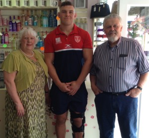 Above: Janet and Dudley Stow with Robbie Mulhern, a rugby player for Hull Kingston Rovers who Love Letters sponsors. 