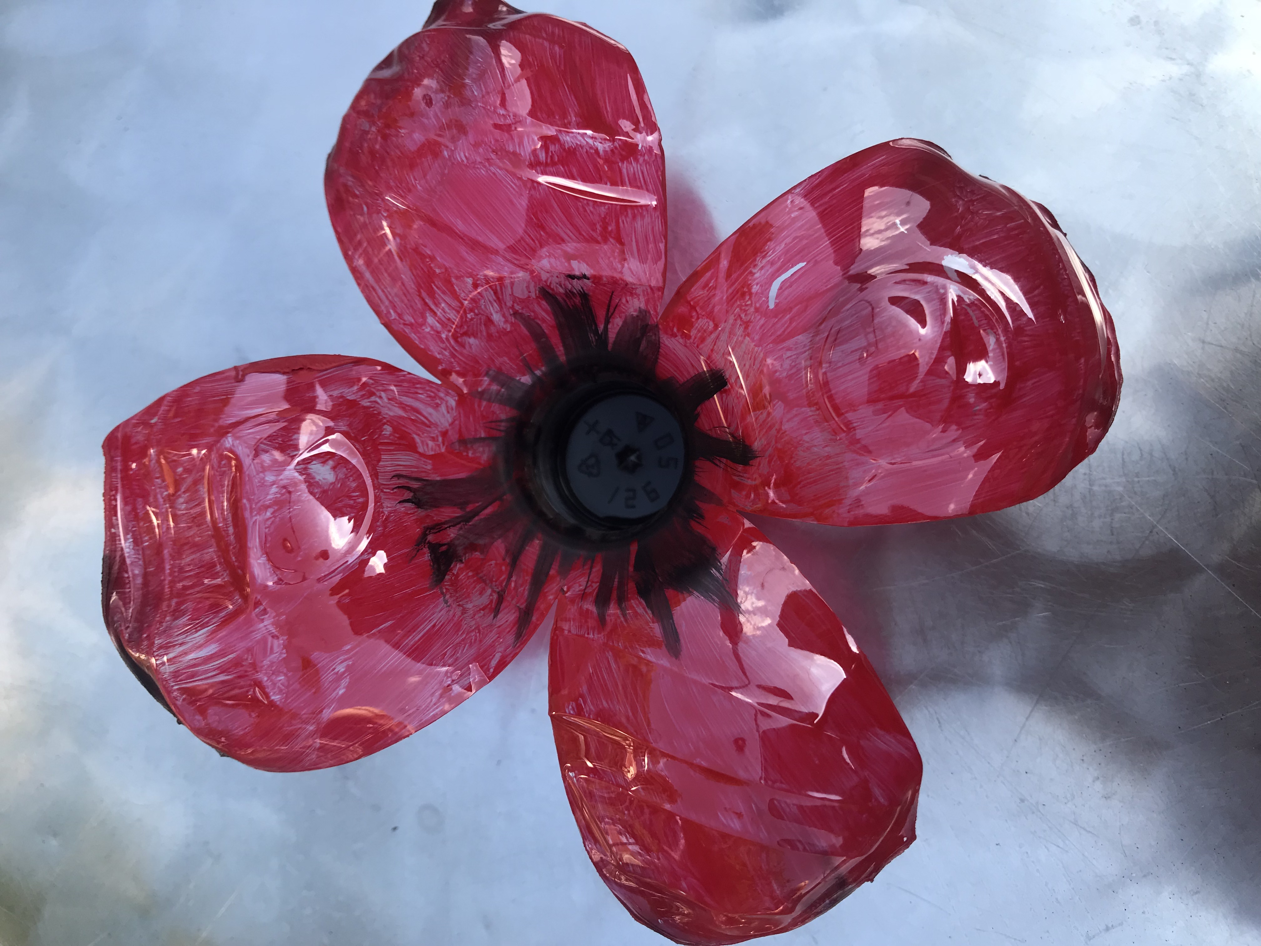  Above: A close up of a plastic bottle poppy made by Jo.