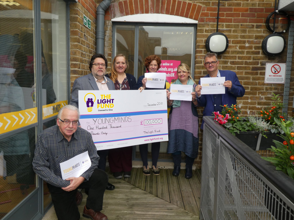 Above: YoungMinds’ ceo Emma Thomas (3rd right) and Jo Hardy (3rd left) were delighted to be presented with the cheque from The Light Fund committee members (right-left) Ian Hyder (Max Publishign), Jakki Brown (PG), Trevor Jones (formerly of Danilo) and Kelvyn Gardner (Lima).