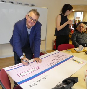 Above: Max Publishing’s Ian Hyder, a co-founder of The Light Fund writing out the big cheque for YoungMinds.