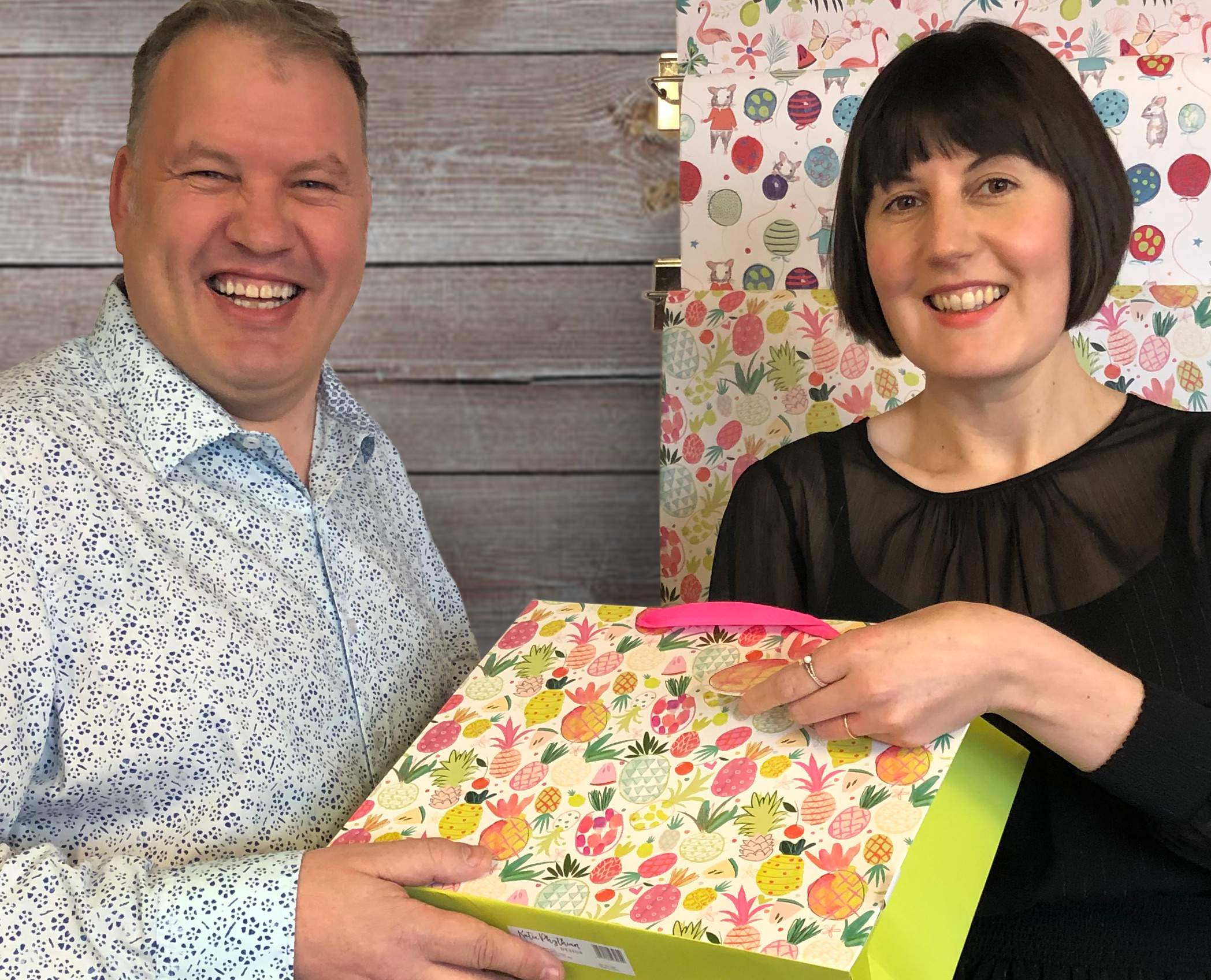 Above: Katie Phythian, namesake of Katie Phythian Design with Andrew Maddock, md of Deva Design with some of the new licensed giftwrappings. 