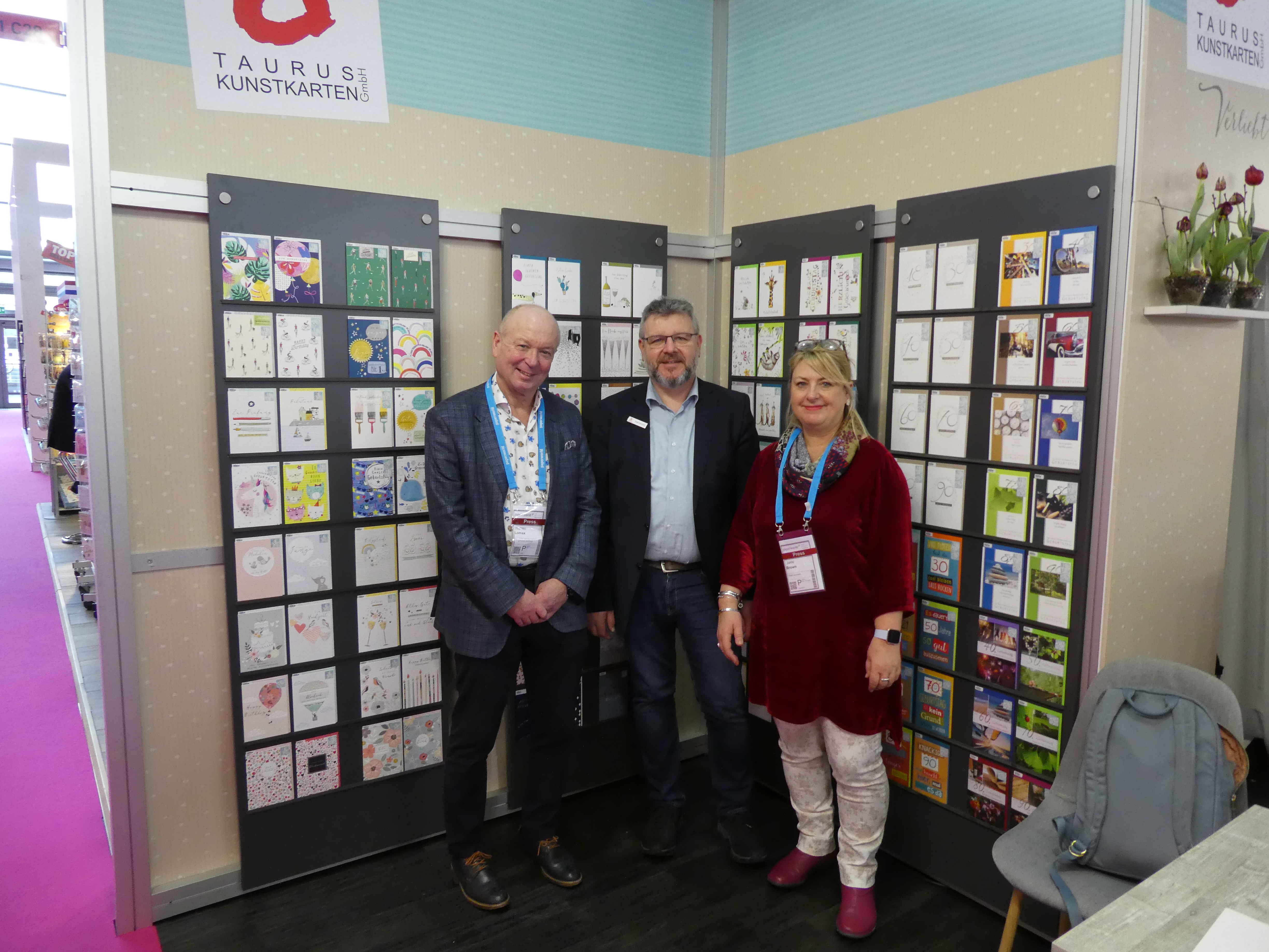 Above: (centre) Stefan Hermann, md of Taurus-Kunstkarten in the ‘British corner’ of his stand where he was displaying Belly Button, Laura Darrington and Louise Melgrew’s cards that his company distributes in Germany. Pictured with PG’s Warren Lomax and Jakki Brown. 