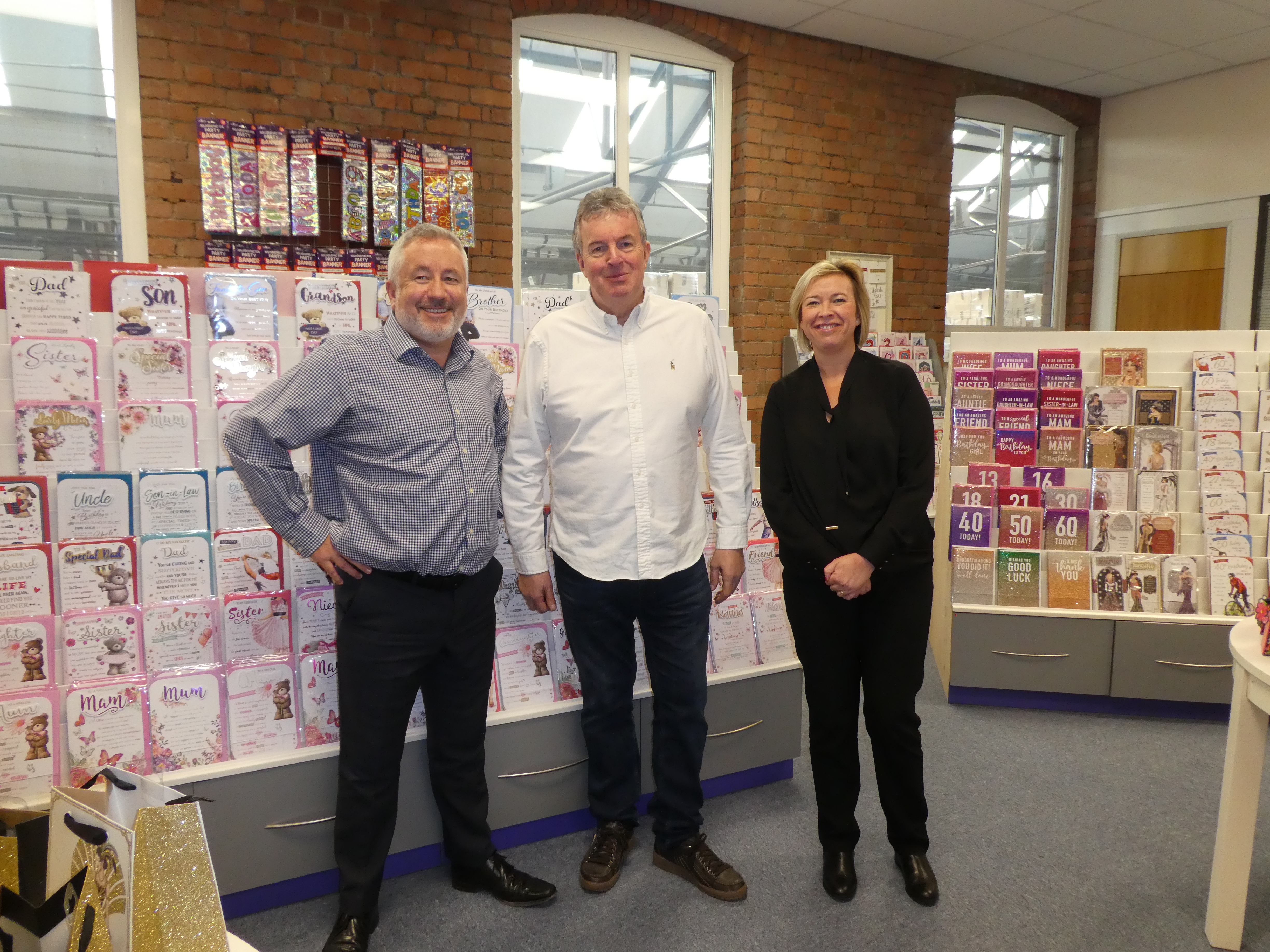 Above: Paul Lavery (centre) with Allan Dunn, director of strategic development with Sarah Hartley, studio manager in the showroom of Budget’s Manchester HQ. 