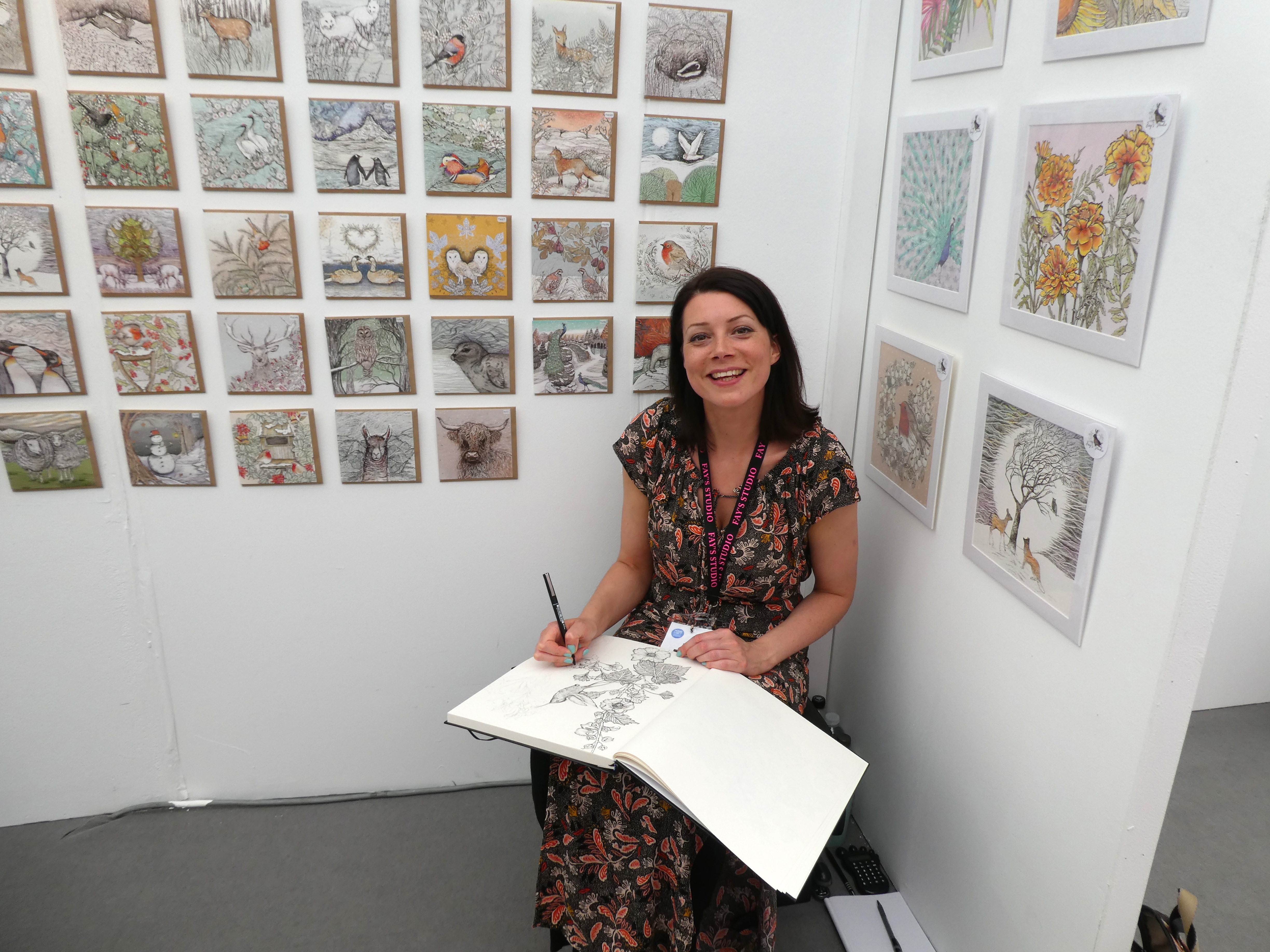Above: No rest for the talented! Faye Miladowska of Fay’s Studios was working on two detailed pointillist designs in between customers coming on the stand.