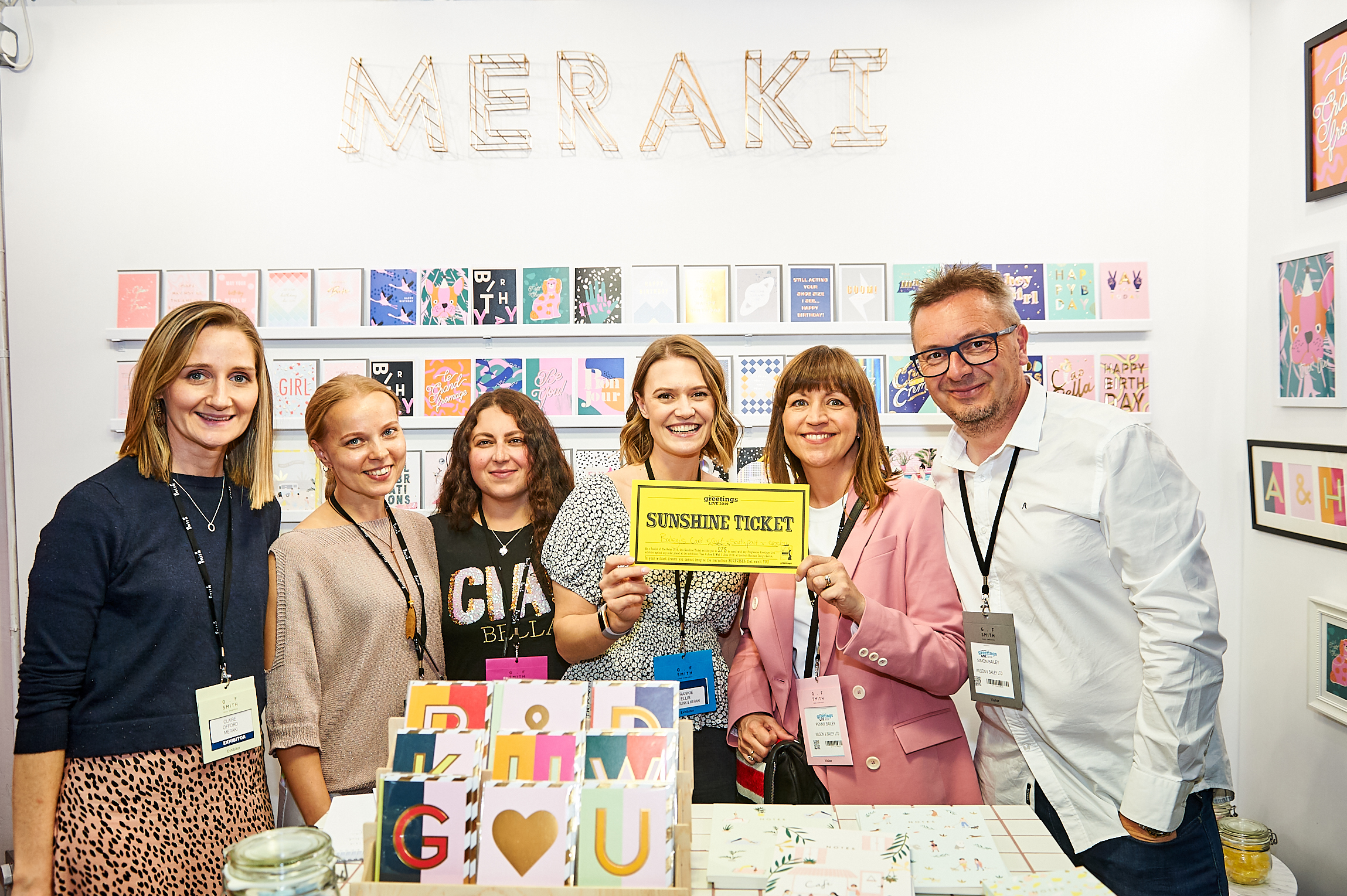 Above: (second right) Penny and Simon Bailey on the Meraki stand which featured the new counter top display of its new Nixie alphabet range.