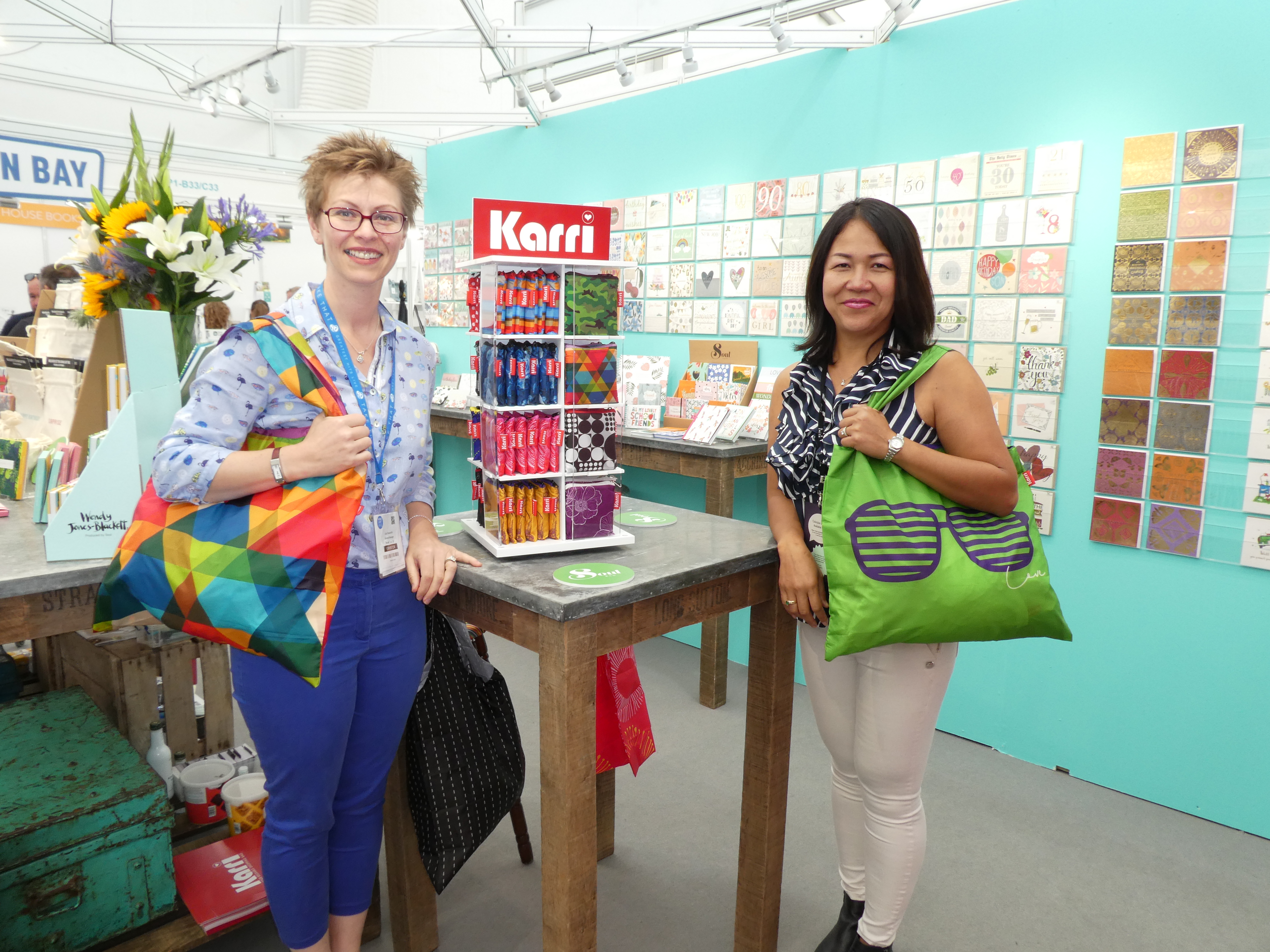 Above: Really Good’s and Soul’s portfolio spans both cards and gifts. Harrogate Home & Gift saw the launch of Soul’s distribution deal for the Karri range of brightly patterned large re-usable shopping bags, created and produced by SSA. Co-owner Maranda Bukong (right) with Soul/Really Good general manager Lisa Shoesmith. 