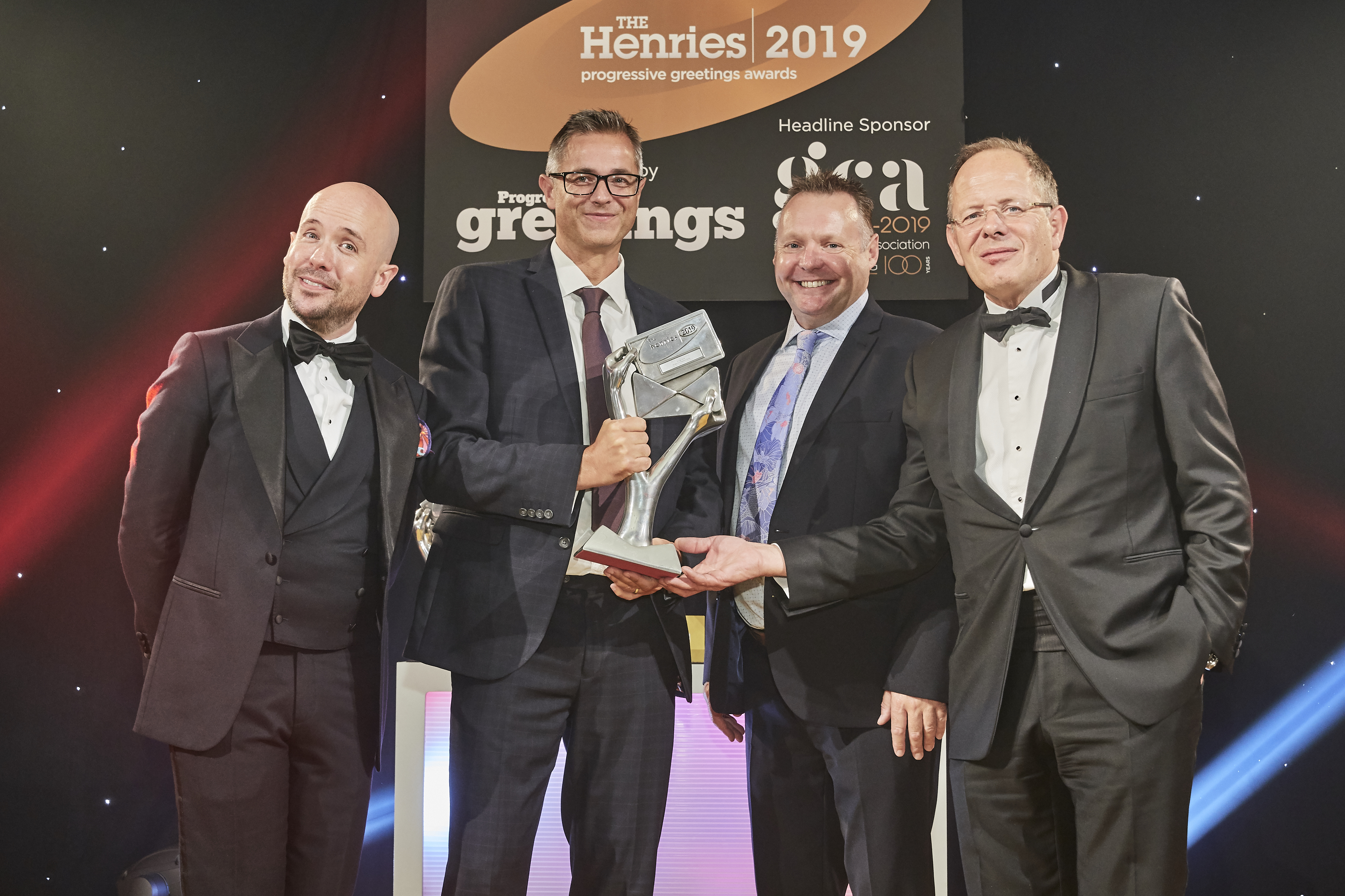 Above: (second left) Chris Stanley, co-owner of Redback Cards and (second right) Sean Edwards, the company’s sales and marketing manager were presented with the trophy by Bruce Podmore, managing director of Windles, the sponsor of this category. 
