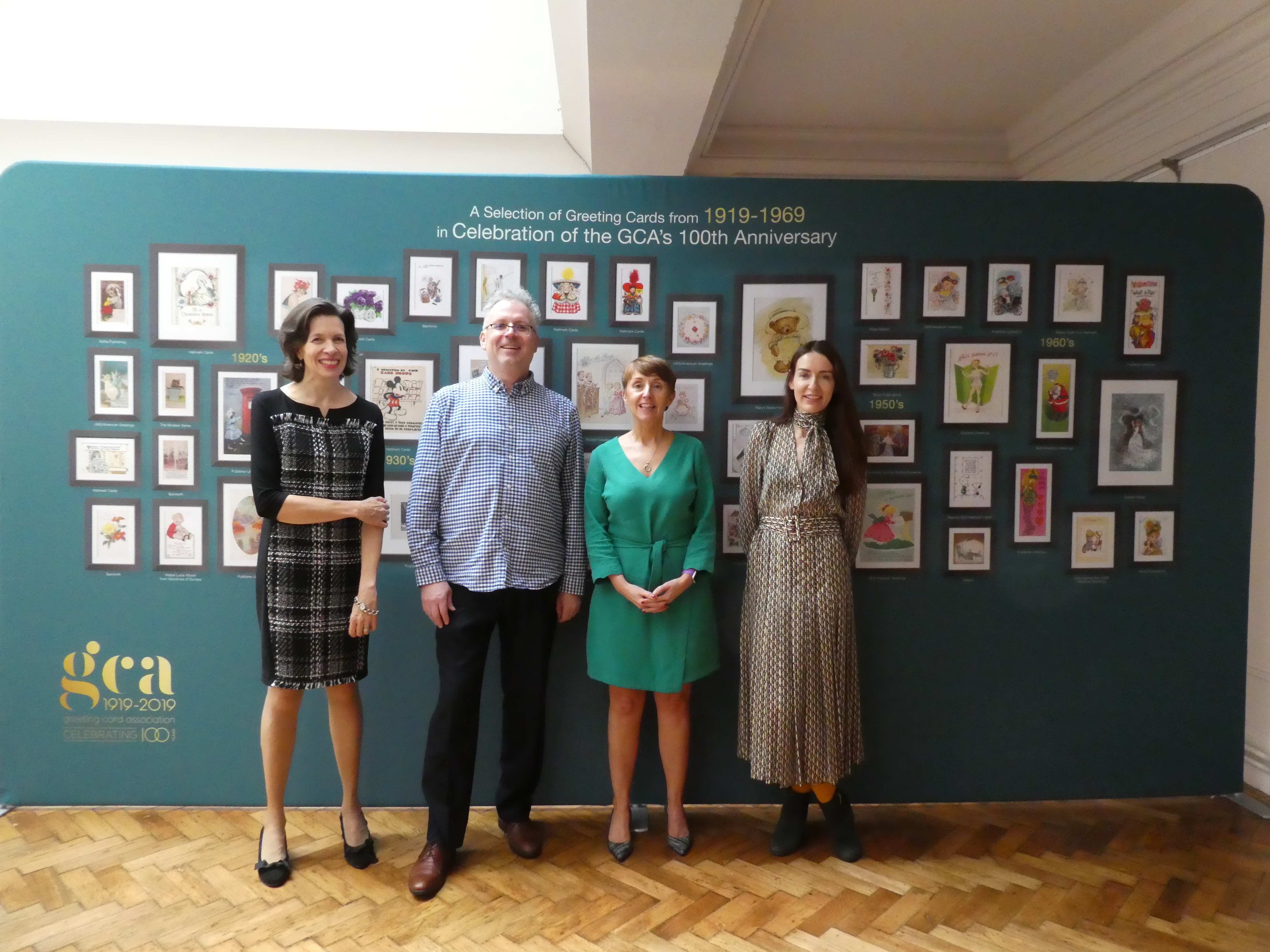 Above: The event saw the launch of a transportable exhibition to celebrate 100 years of the GCA through greeting cards of the last century. (Left-right) New GCA president Rachel Hare (Belly Button), outgoing president Ceri Stirland (UKG), Geoff Sanderson (Celebration Nation, who curated the exhibition) and Amanda Fergusson (GCA) in front of one of four sides of the exhibition panels. 