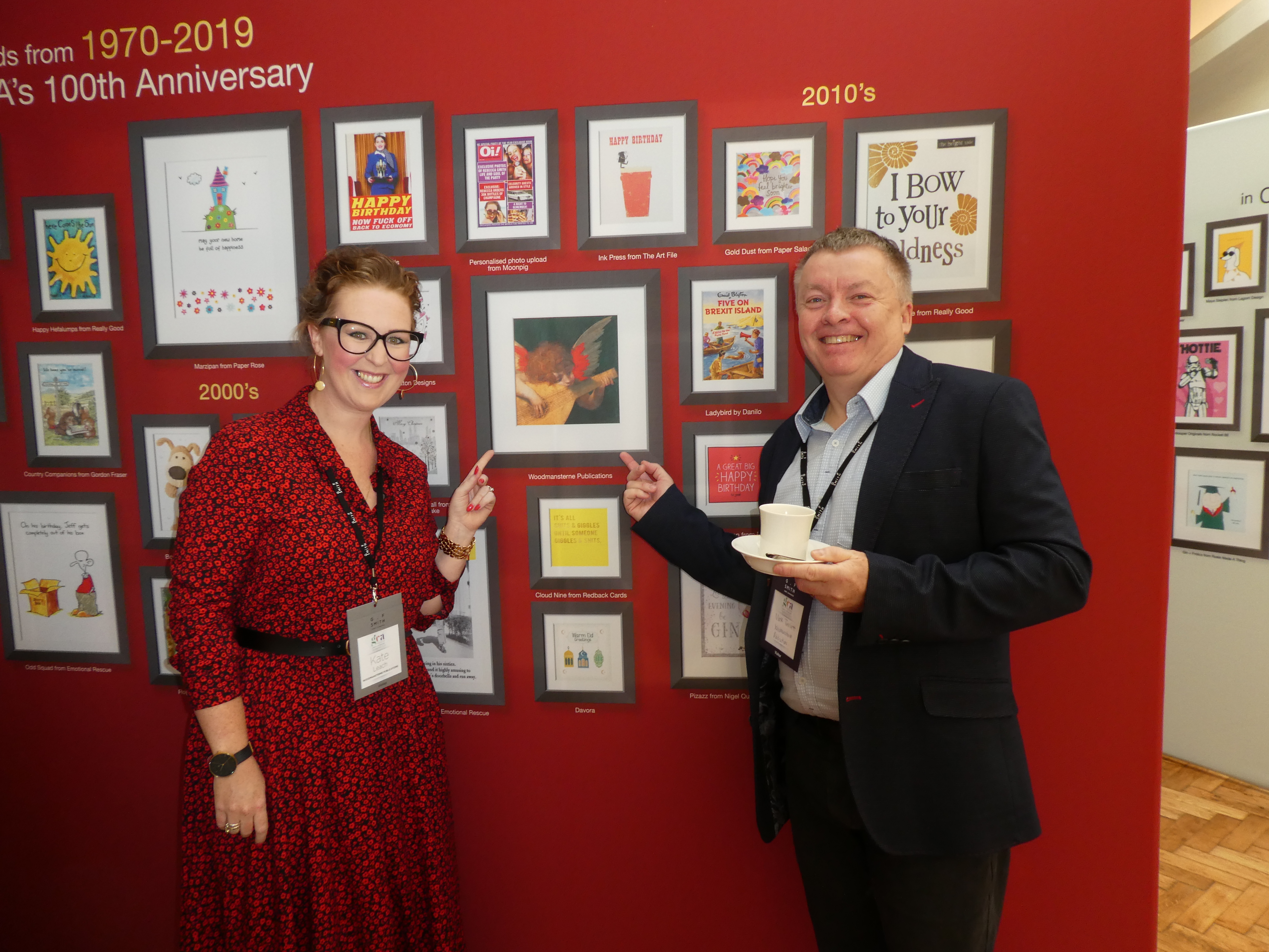 Above: Woodmansterne’s Kate Leach and Mark Timlett were delighted to see one of the publisher’s early art designs included in the 100th anniversary exhibition. 