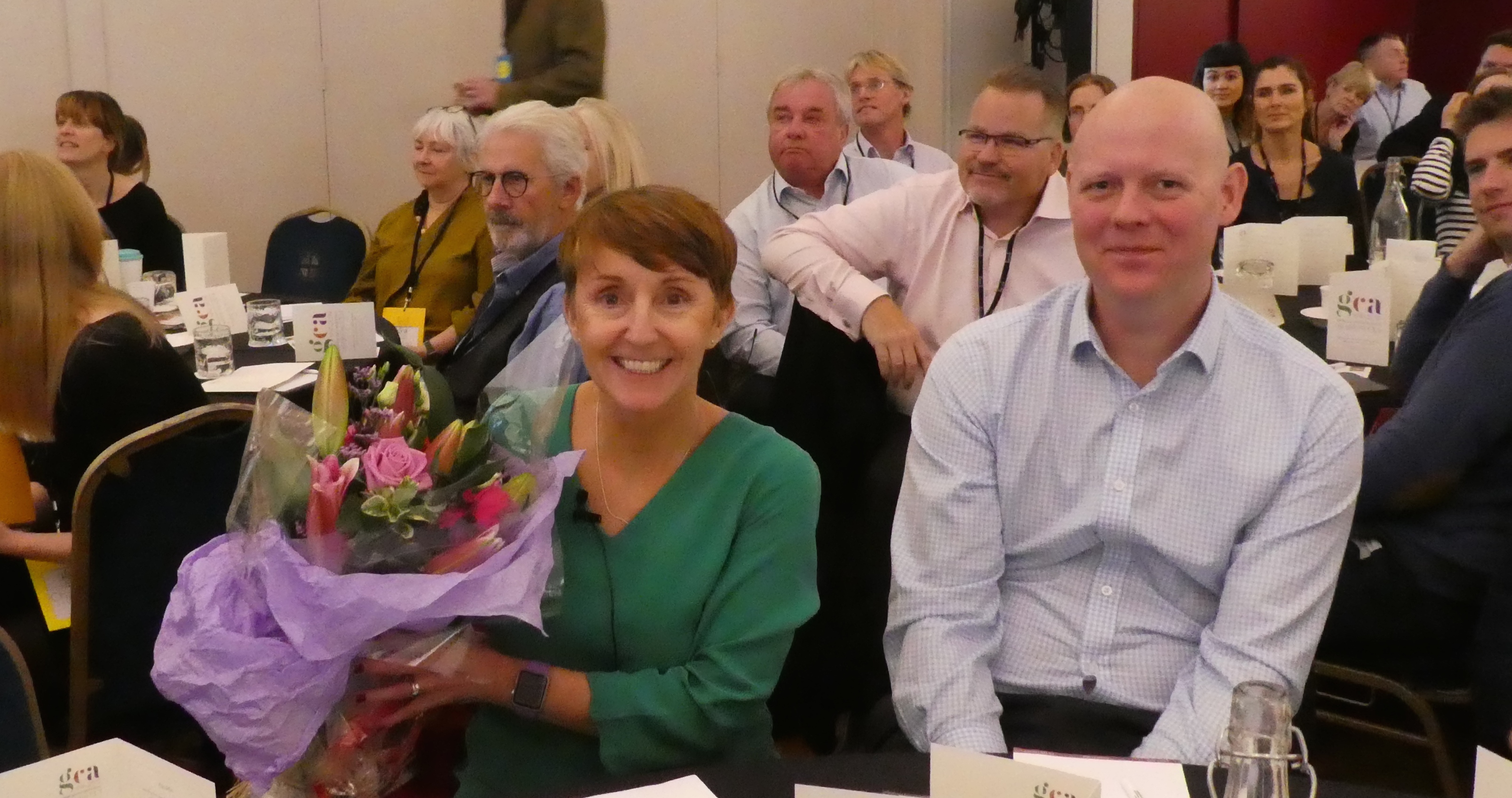 Above: Ceri Stirland was presented with a bouquet of flowers as a token of appreciation for all her work as president and longstanding council member. Her colleague Darren Cave (right) has just joined the council thereby maintaining a UKG presence. 