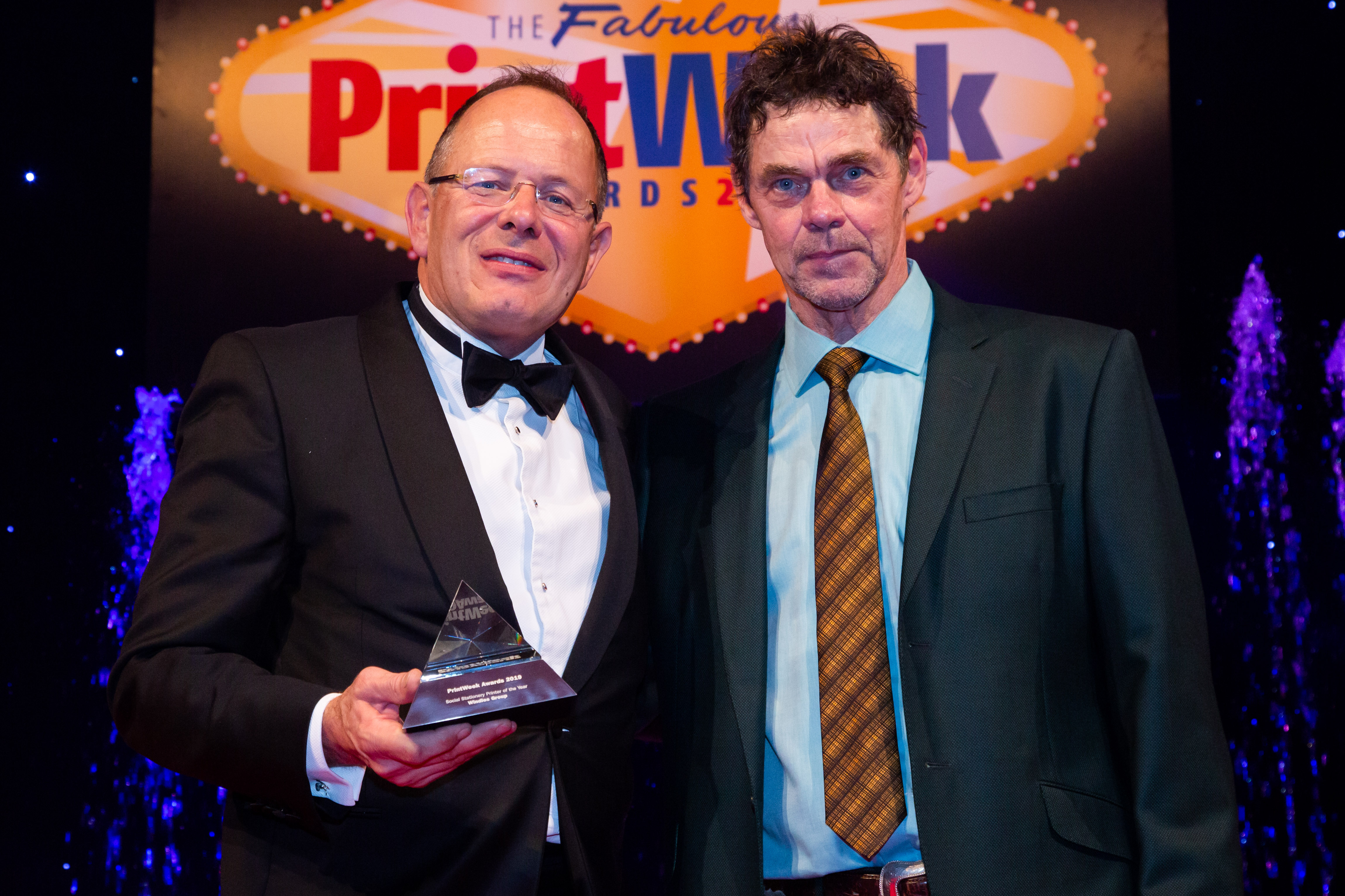 Above: Windles’ md Bruce Podmore (left) with the prestigious award, presented by comedian Rich Hall, host for the event. 