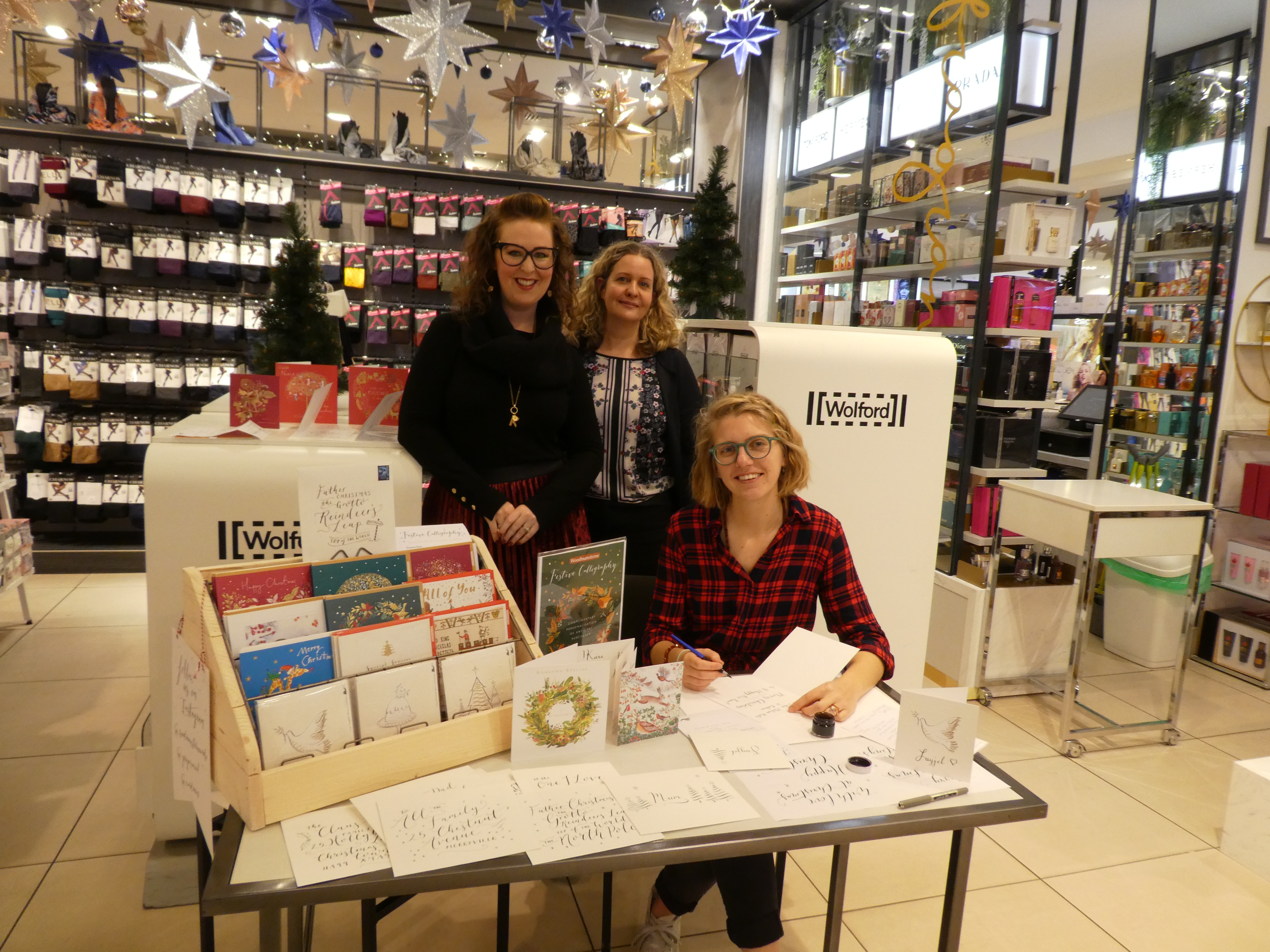 Above: The calligraphy event in Elys of Wimbledon which was adjacent to the card displays. Elys’ card buyer Kate Nelligan (centre) with designer Beth Lewton (right) and Woodmansterne’s marketing manager Kate Leach. 