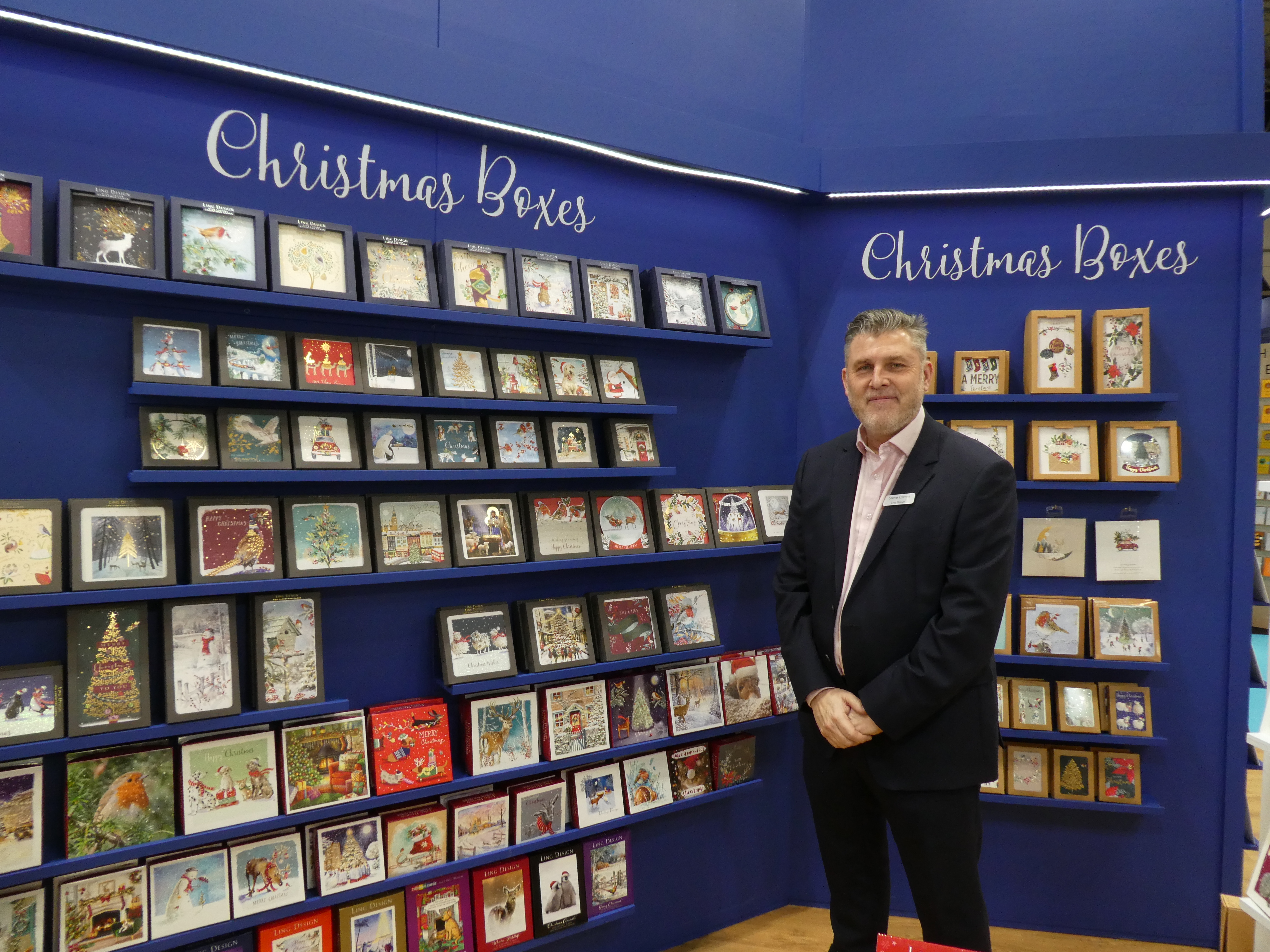 Above: Ling Group’s Steve Camm on its stand at Spring Fair with some of the Ling Design new approaches to Christmas boxes which sees a reduction in many tonnes of plastic. 