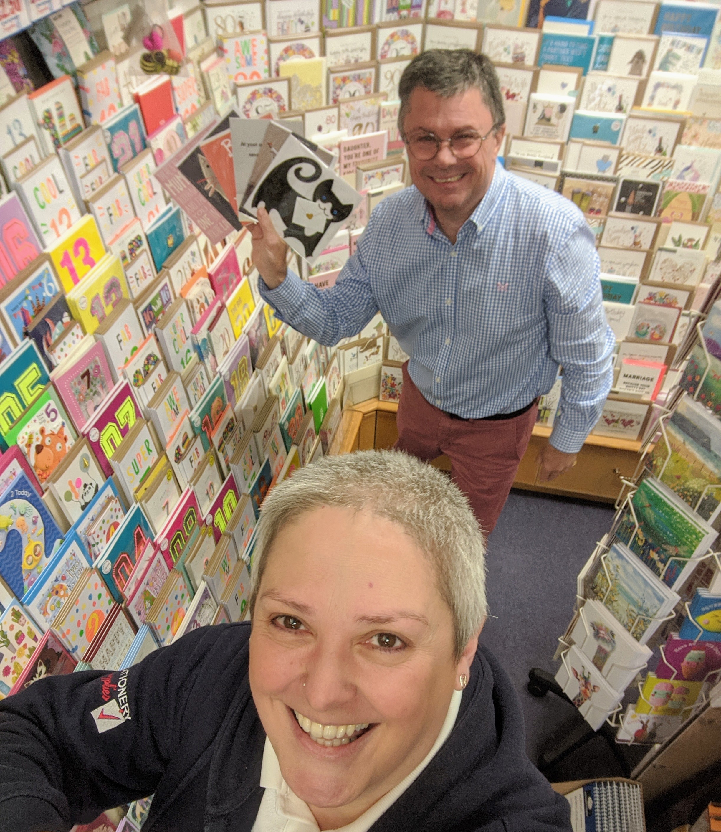 Above: Nigel Willcock, now an agent during a recent socially distanced appointment with Sarah Laker of Marple Stationery Supplies.