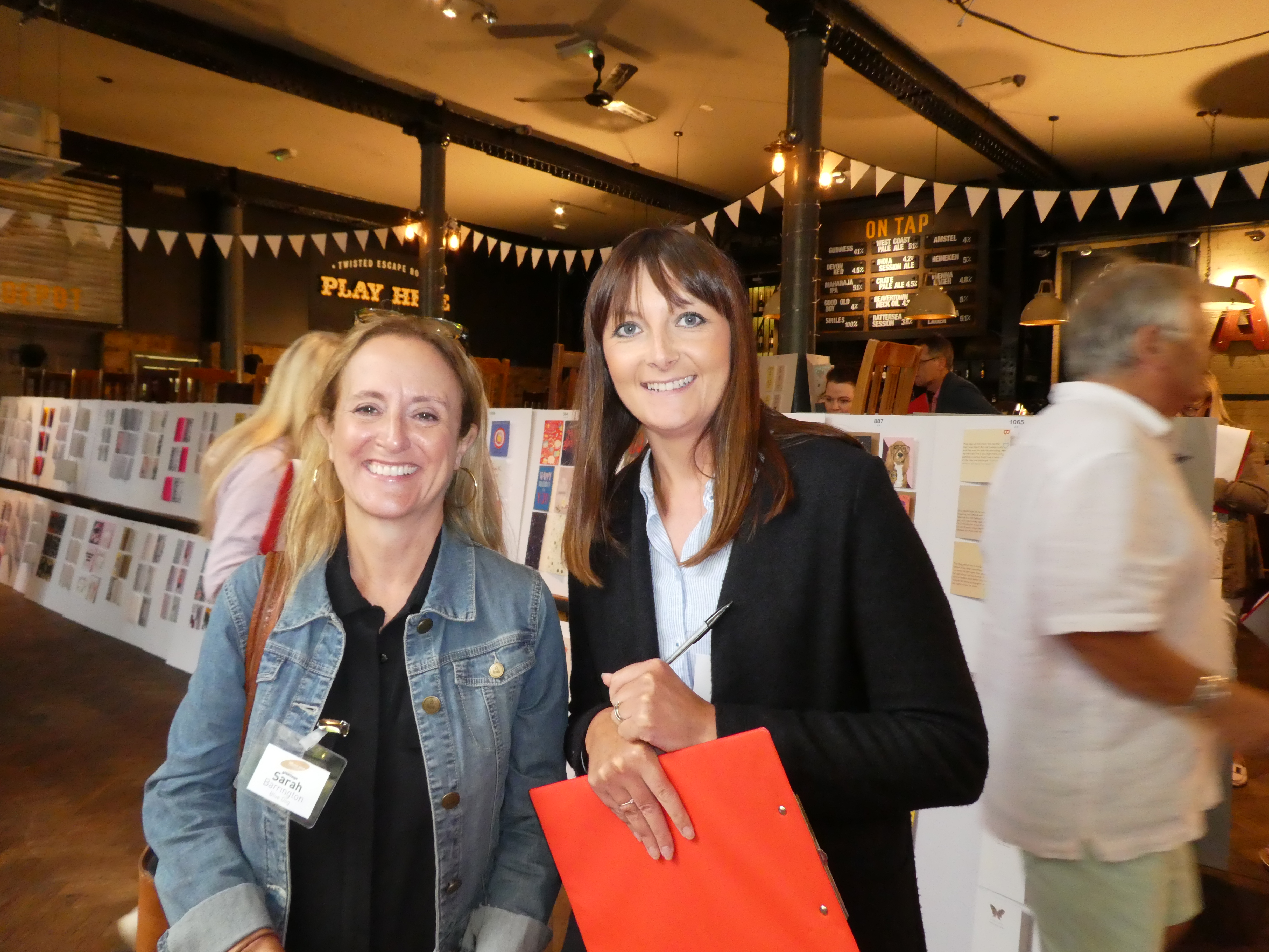 Above: Barkers’ Sarah Lishman (right) and Blue Dog Trading’s Sarah Barrington at last year’s physical Henries judges. Both are among the 70 retailers to be logging on to vote for this year’s entries over the coming week.