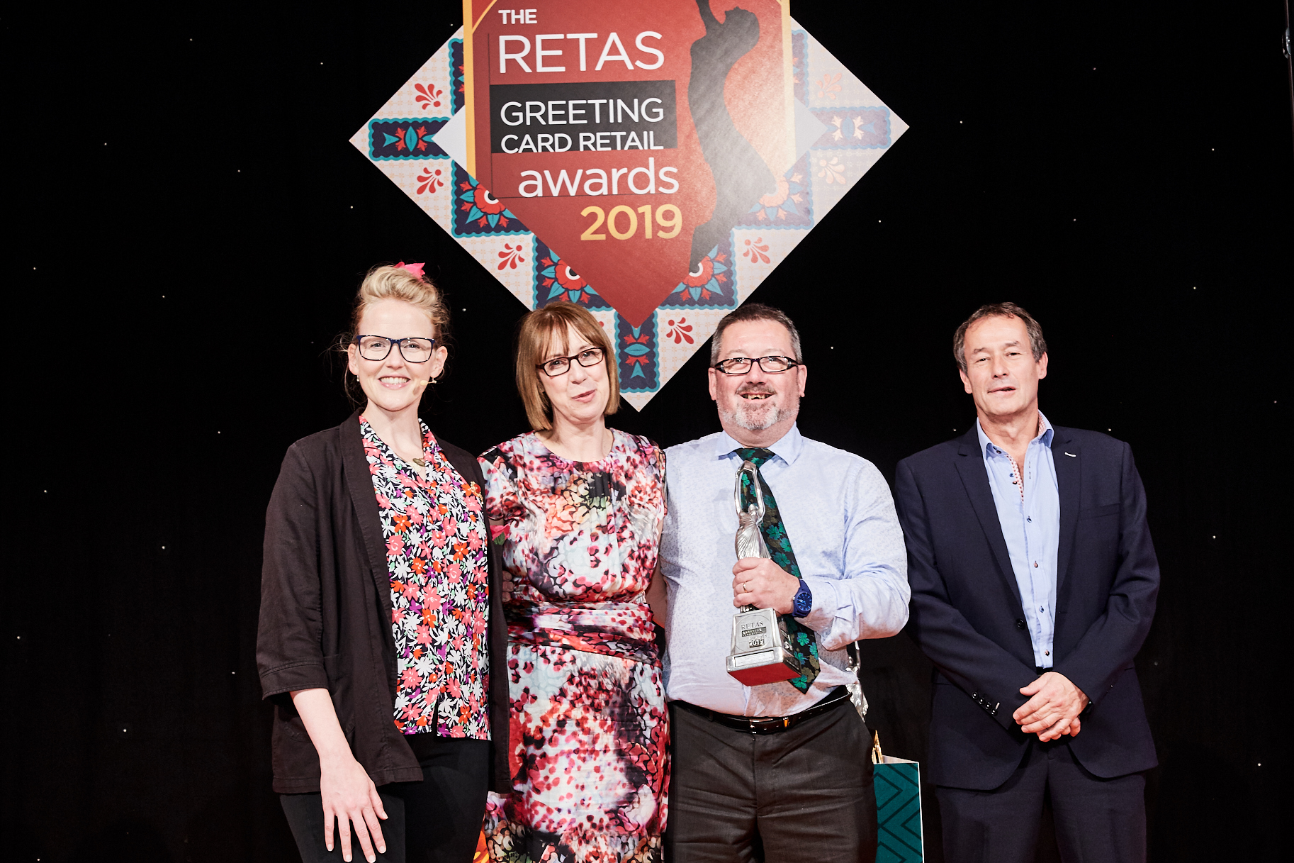 Above: (second and third left) Nigel and Karen Hamilton-Evans collecting their Retas award from Alister Marchant, ceo of Carte Blanche, sponsor of the award category and host Pippa Evans.