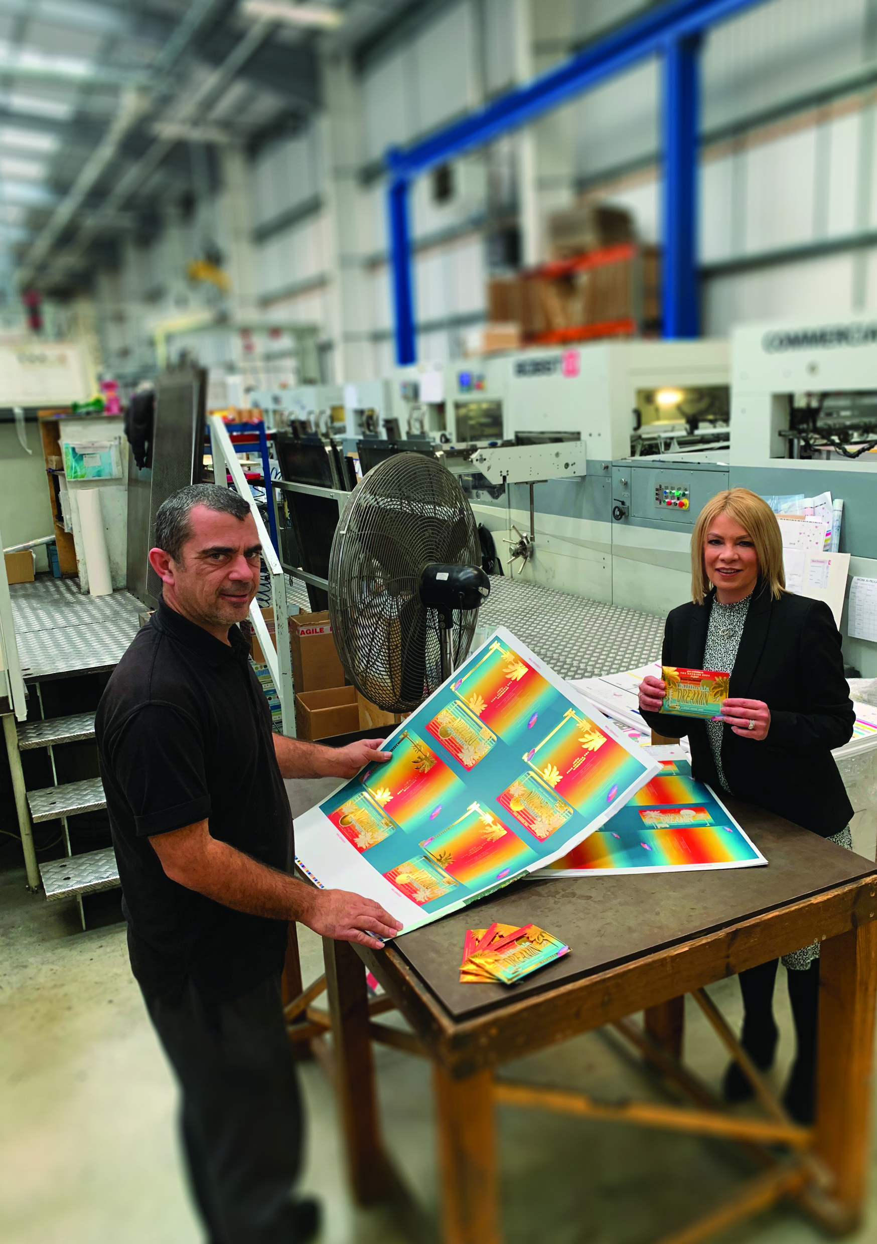 Above: Windles’ Andrea Norcott and Glenn Hayer The Henries invitations as they come off the presses.