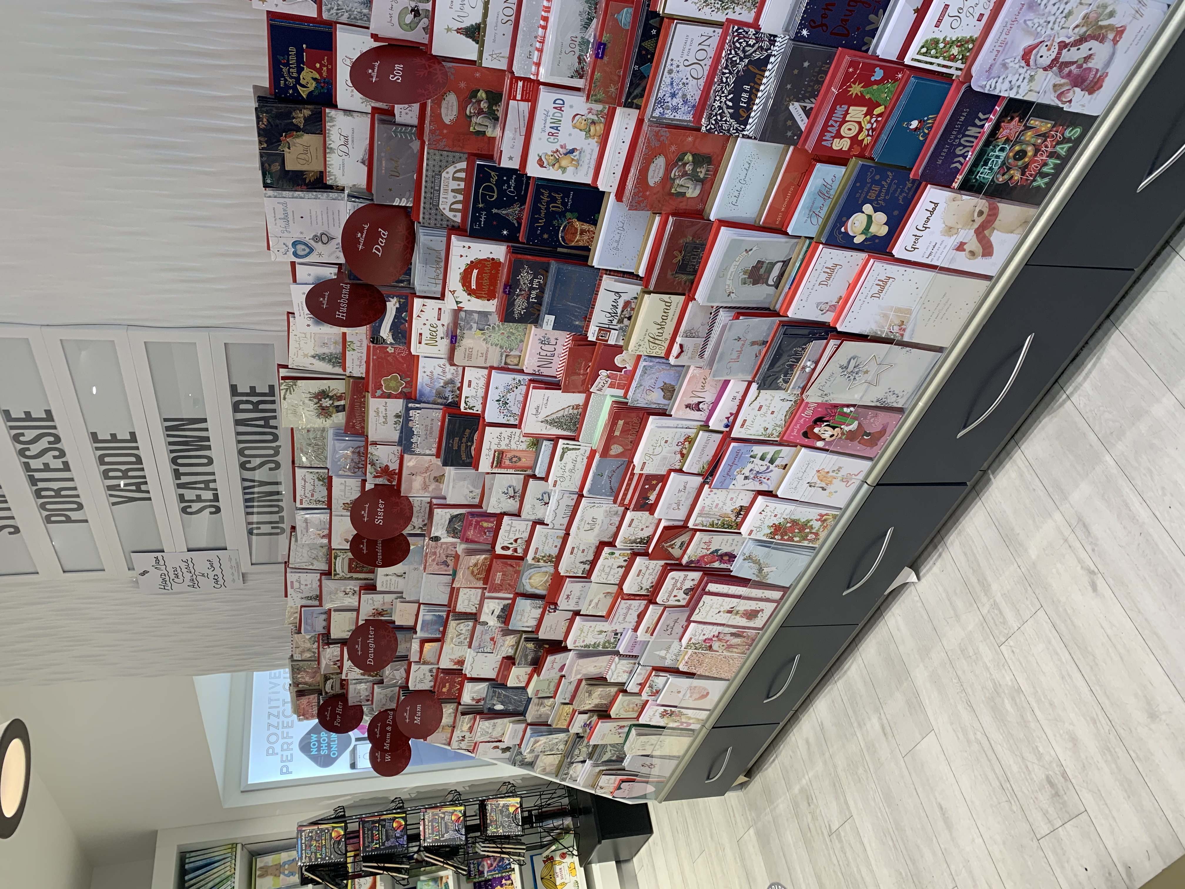 Above: One of the Christmas card displays in David’s shops which are full of special captions.