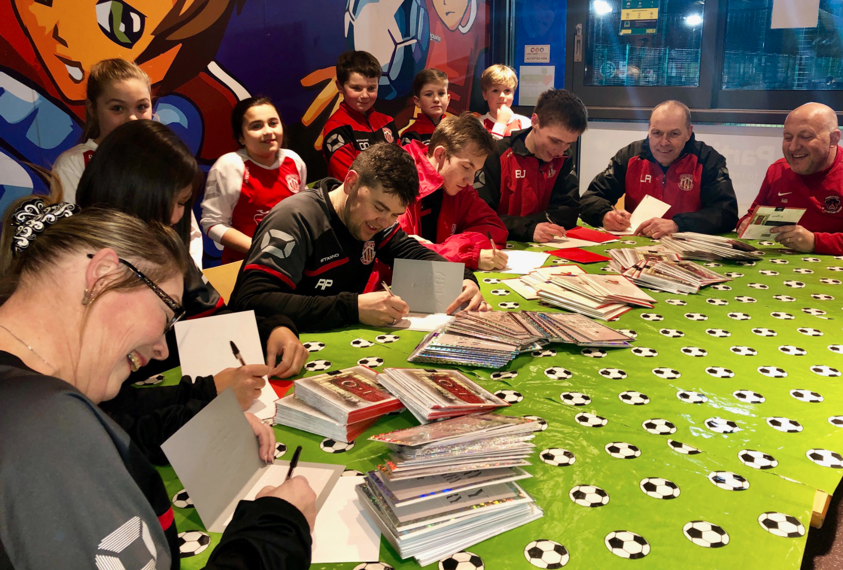 Above: Part of Hallmark’s Festive Friday activities a few years ago which saw the publisher create a card sending event with local football club, Thackley Juniors involving the players and the coaches.