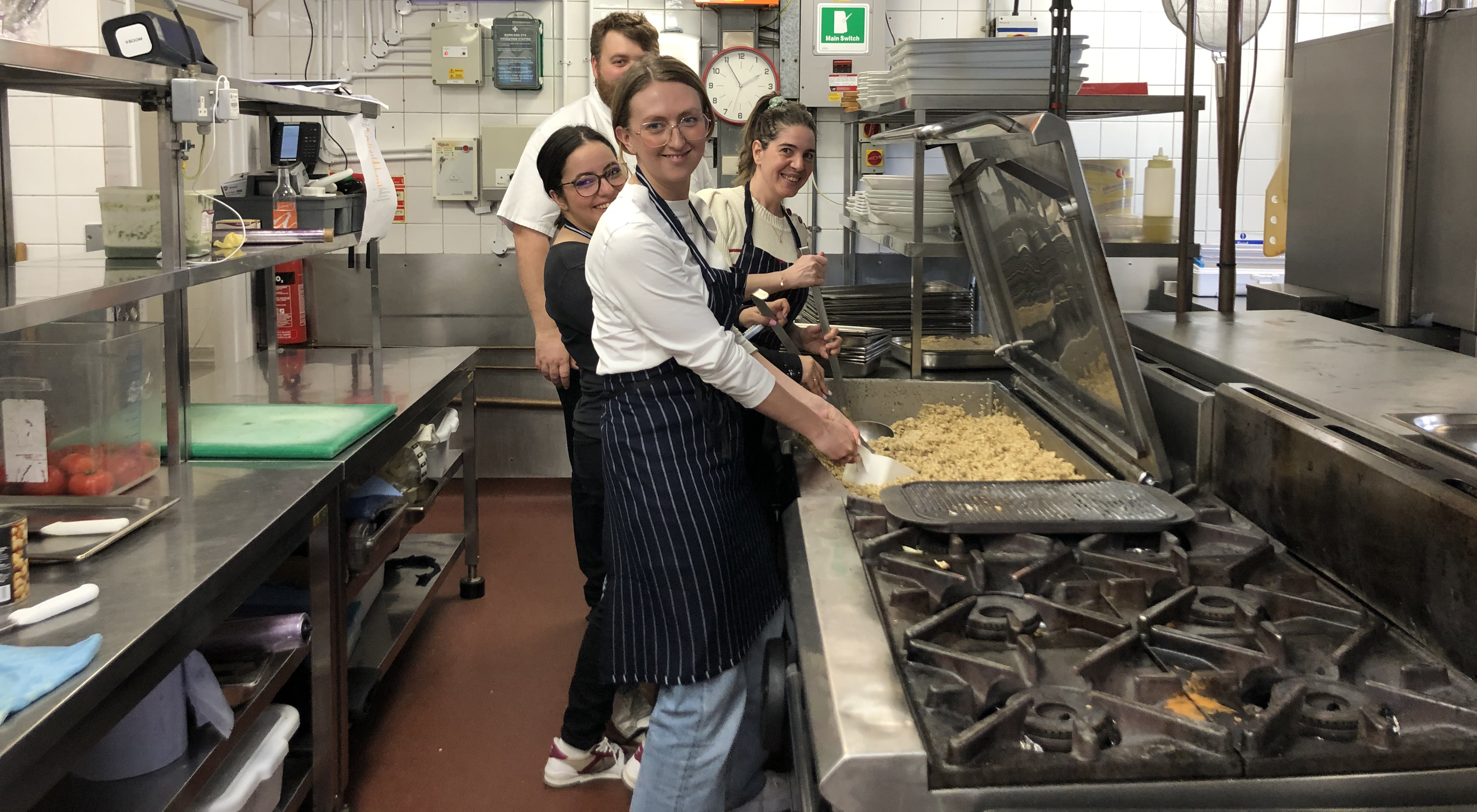 Above: Grub’s up! – Ankorstore’s (front to back) Lucy Clarke, Chama Saddiqi and Rita Tavares with chef Michael Jelley behind the scenes in the Business Design Centre’s kitchens
