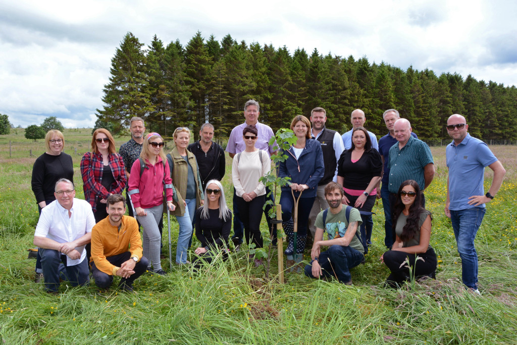 Above: Digging in – planting trees on the educational tour
