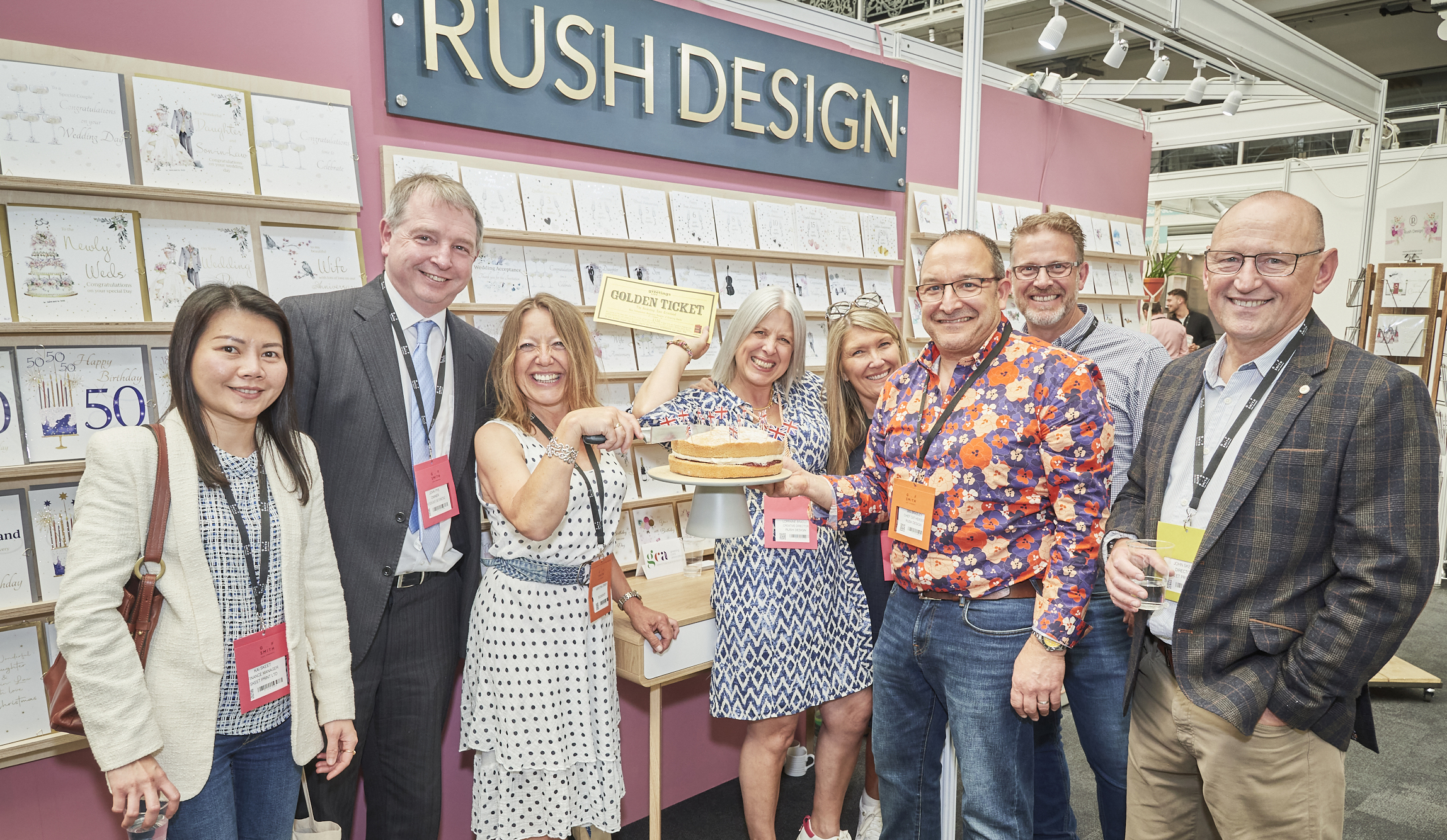 Above: Having their cake and eating it – Rush Design’s Lorraine (centre) and Ian Bradley (3rd right) shared a slice with chums from Hugs & Kisses, Skeet Print and The East Grinstead Bookshop at PG Live