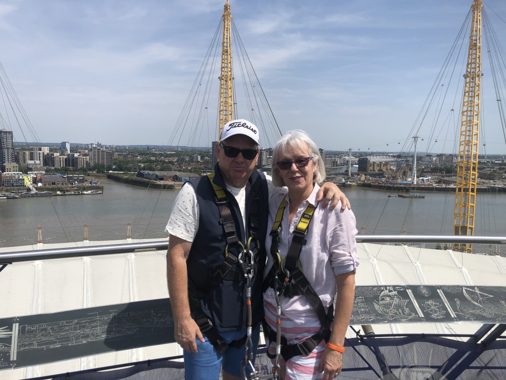 Above: On top of the world! Roy and Julia celebrate their 2022 Retas win at the O2 Millennium Dome