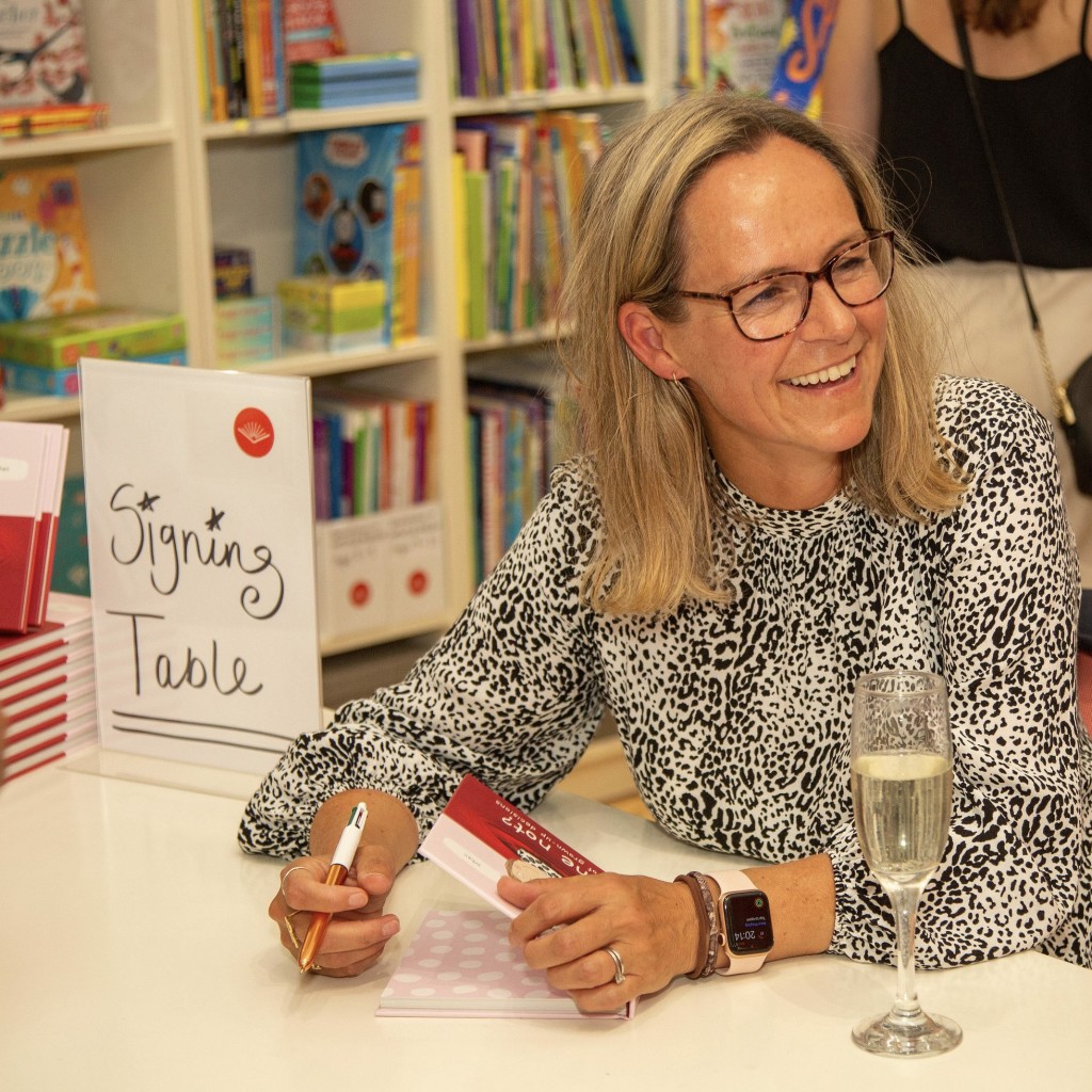 Above: Rosie personally signs copies of her first book