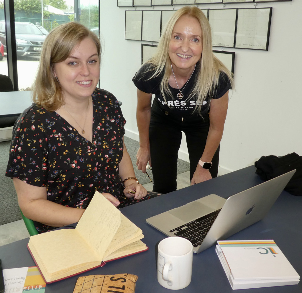 Above: Deckled Edge’s Janna Cossettini helps Gracie Thomson prepare her design for print